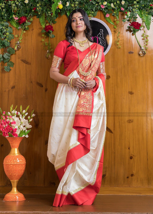 Silk Saree from the store is adorned with beautiful Zari work Saree