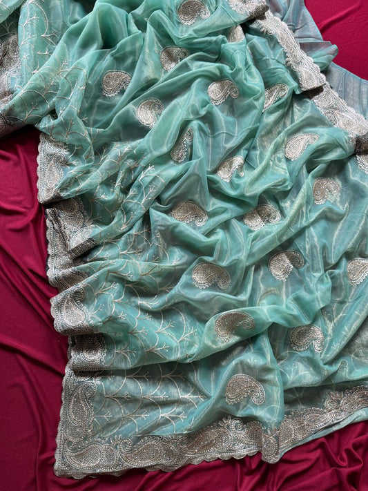 Pure zari tissue silk saree in a solid color with embroidery saree