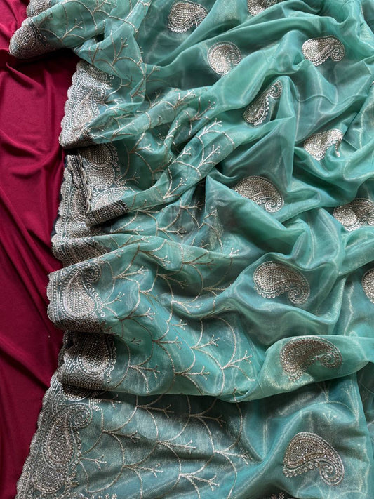 Pure zari tissue silk saree in a solid color with embroidery saree
