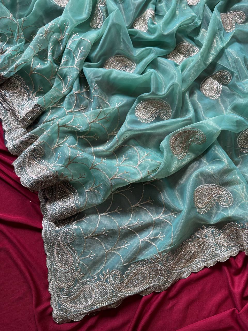 Pure zari tissue silk saree in a solid color with embroidery saree