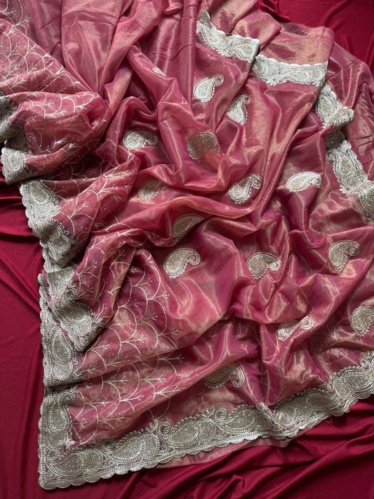 Pure zari tissue silk saree in a solid color with embroidery saree