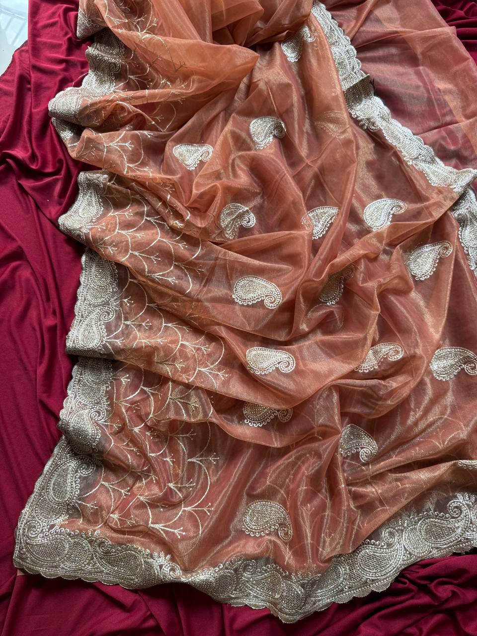 Pure zari tissue silk saree in a solid color with embroidery saree