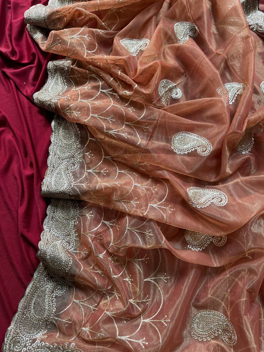 Pure zari tissue silk saree in a solid color with embroidery saree