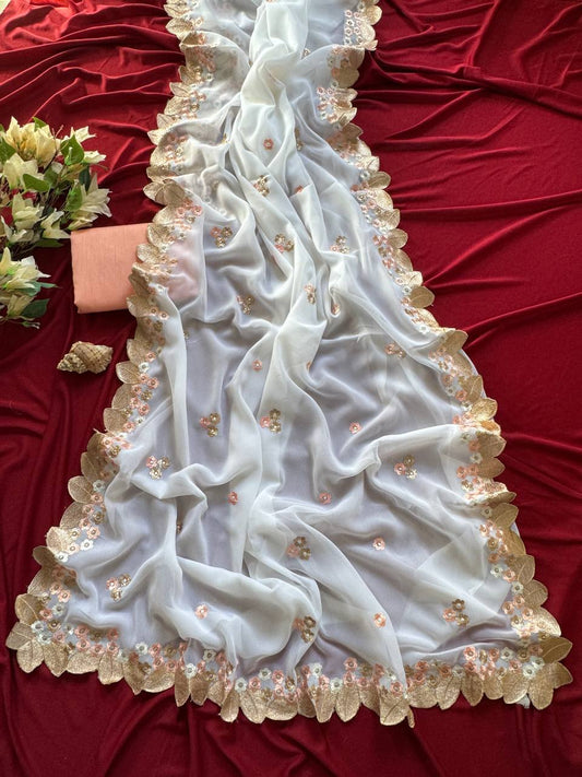 white chiffon georgett saree adorned with peach & gold floral embroidery saree