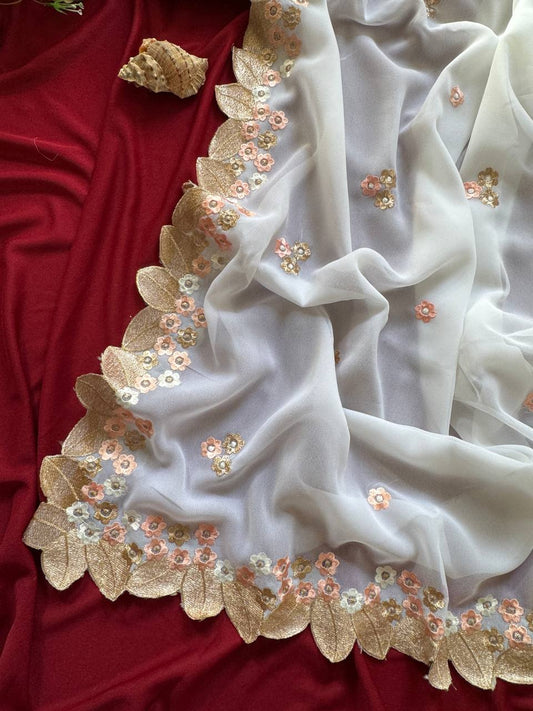 white chiffon georgett saree adorned with peach & gold floral embroidery saree