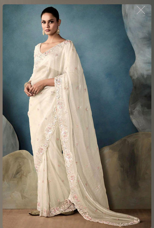Adorned with delicate thread & sequin work Saree
