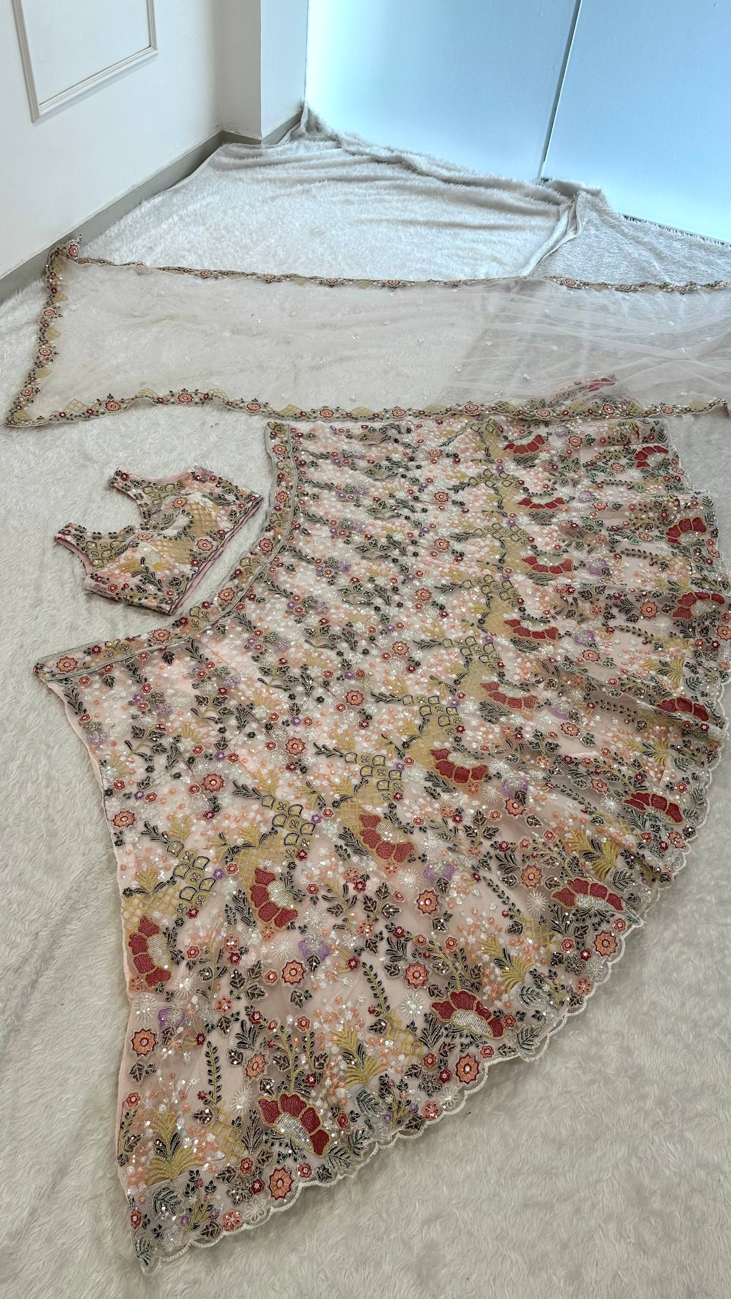 Net lehenga with rainbow sequins Dori & thread work choli