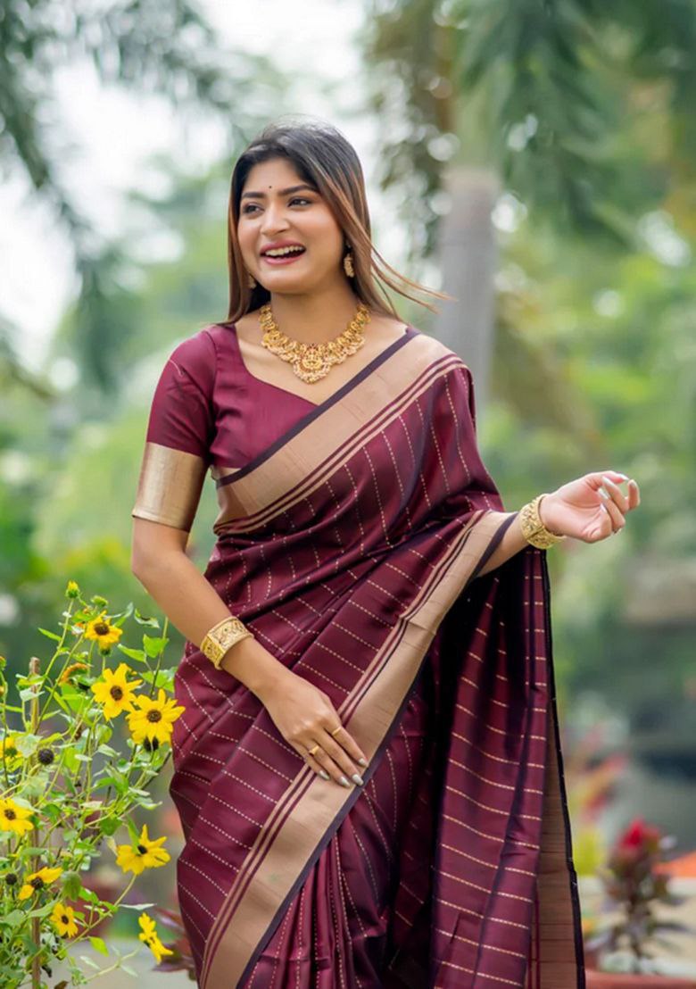 adorned with beautiful Zari work in form of traditional motifs