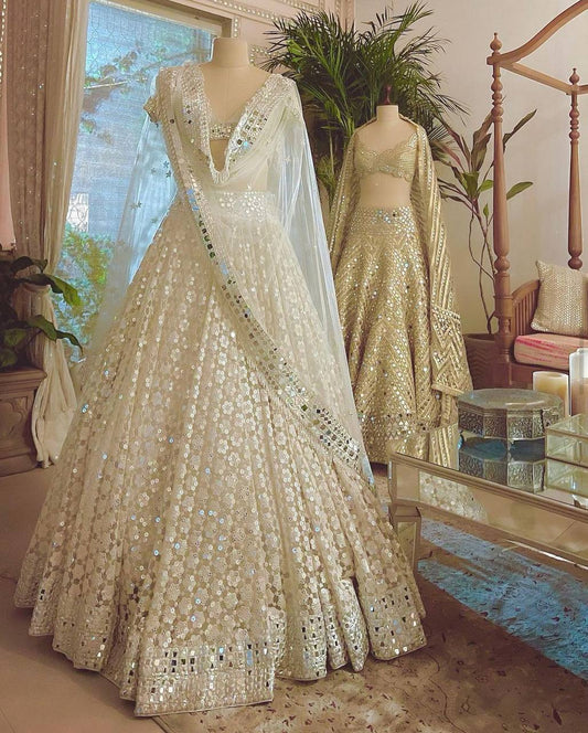 Look drop dead gorgeous in this beautiful off white lehenga set