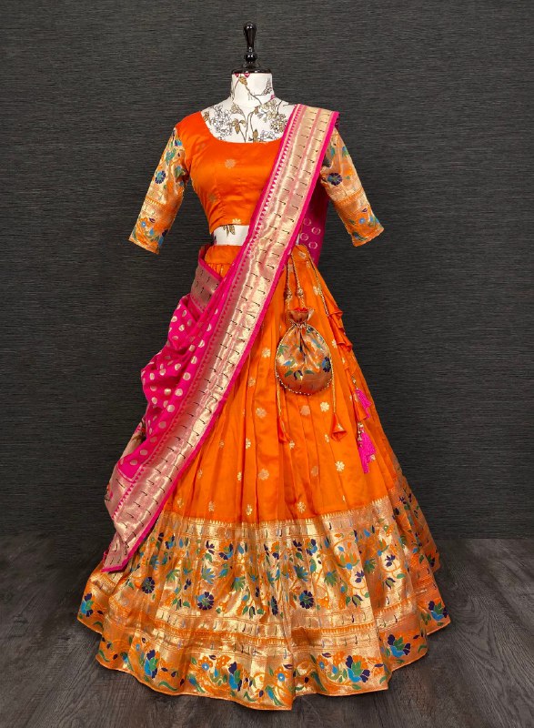 Get traditional touch to your look adorning this orange color lehenga