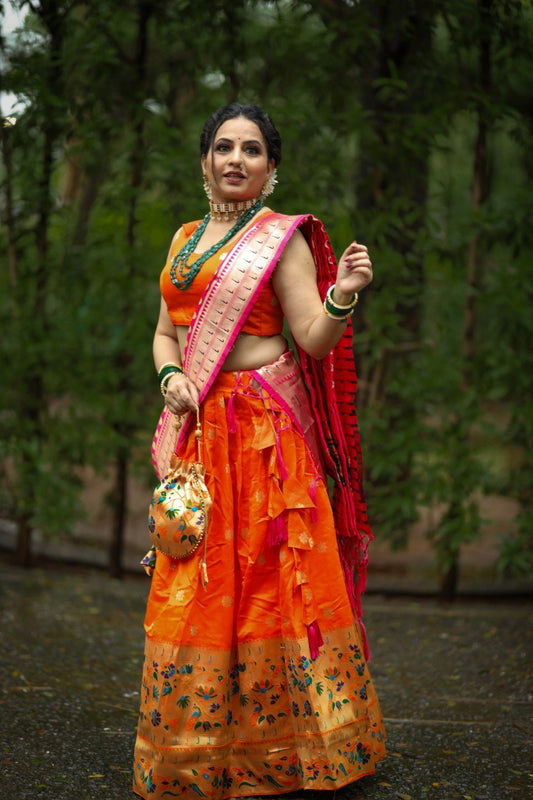 Get traditional touch to your look adorning this orange color lehenga