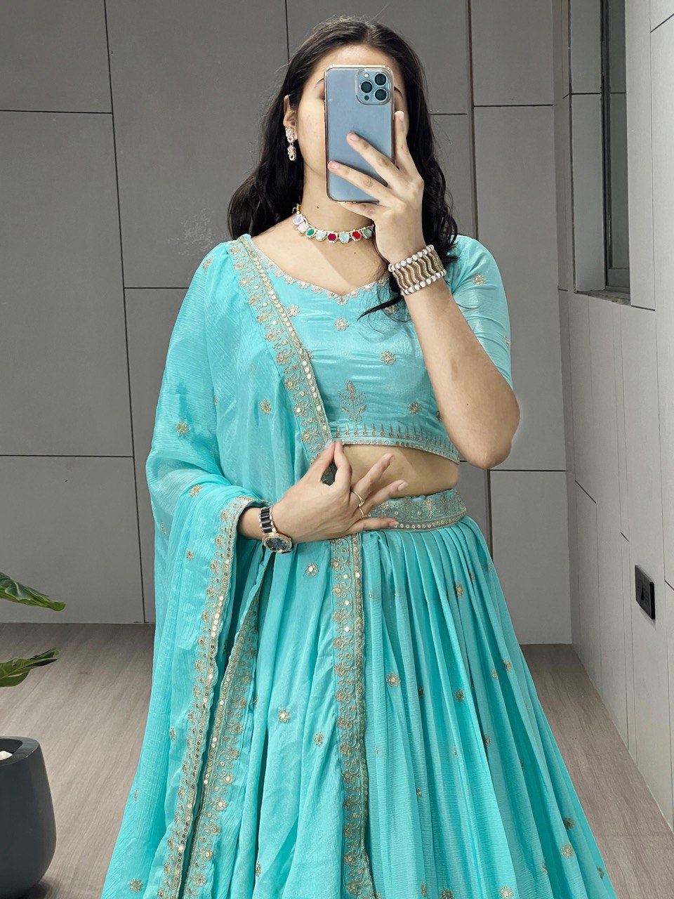 Be the epitome of grace in this Sky Chinon Shiny Lehenga