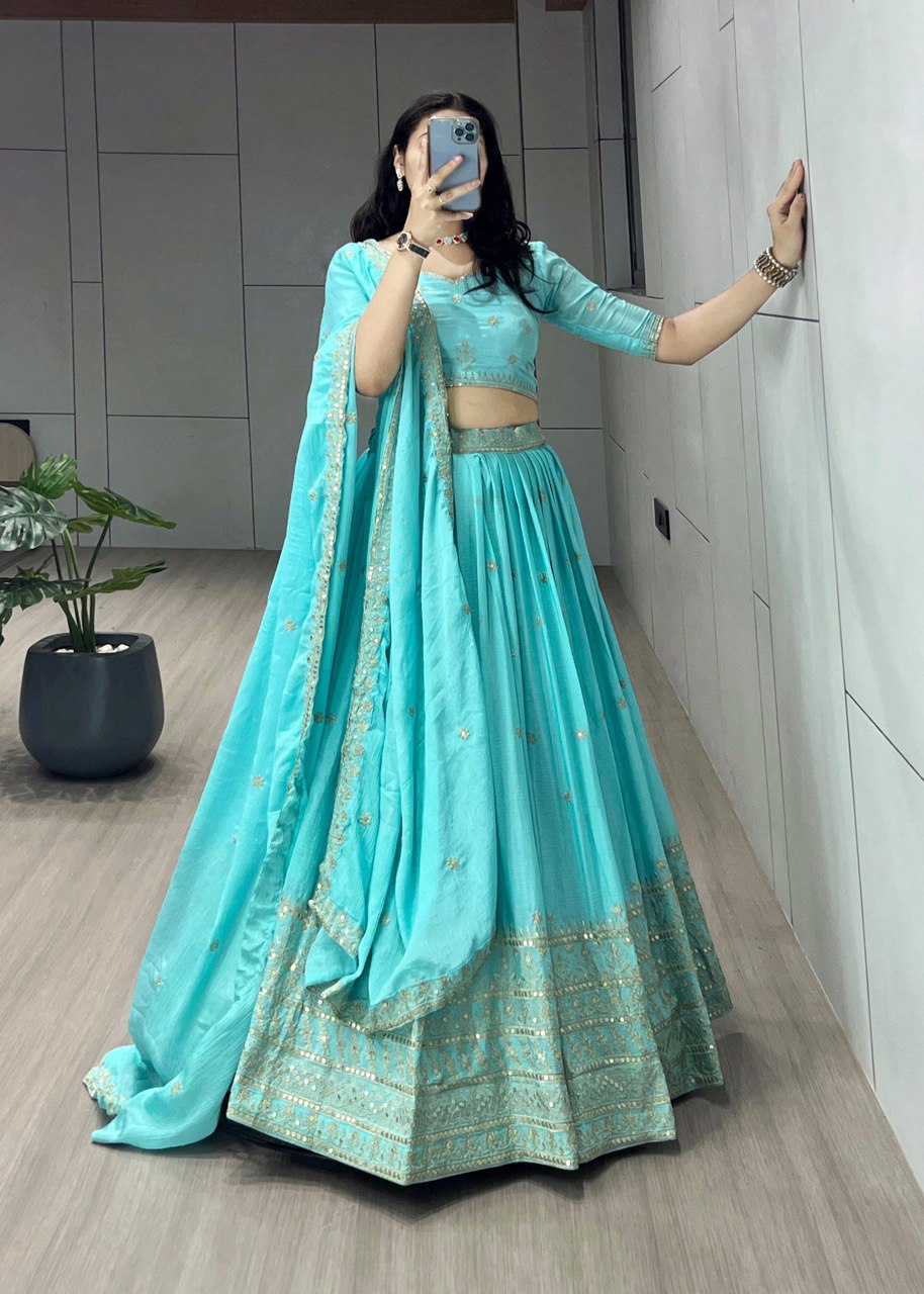 Be the epitome of grace in this Sky Chinon Shiny Lehenga