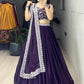 Traditional Indian lehenga set in a rich deep purple shade