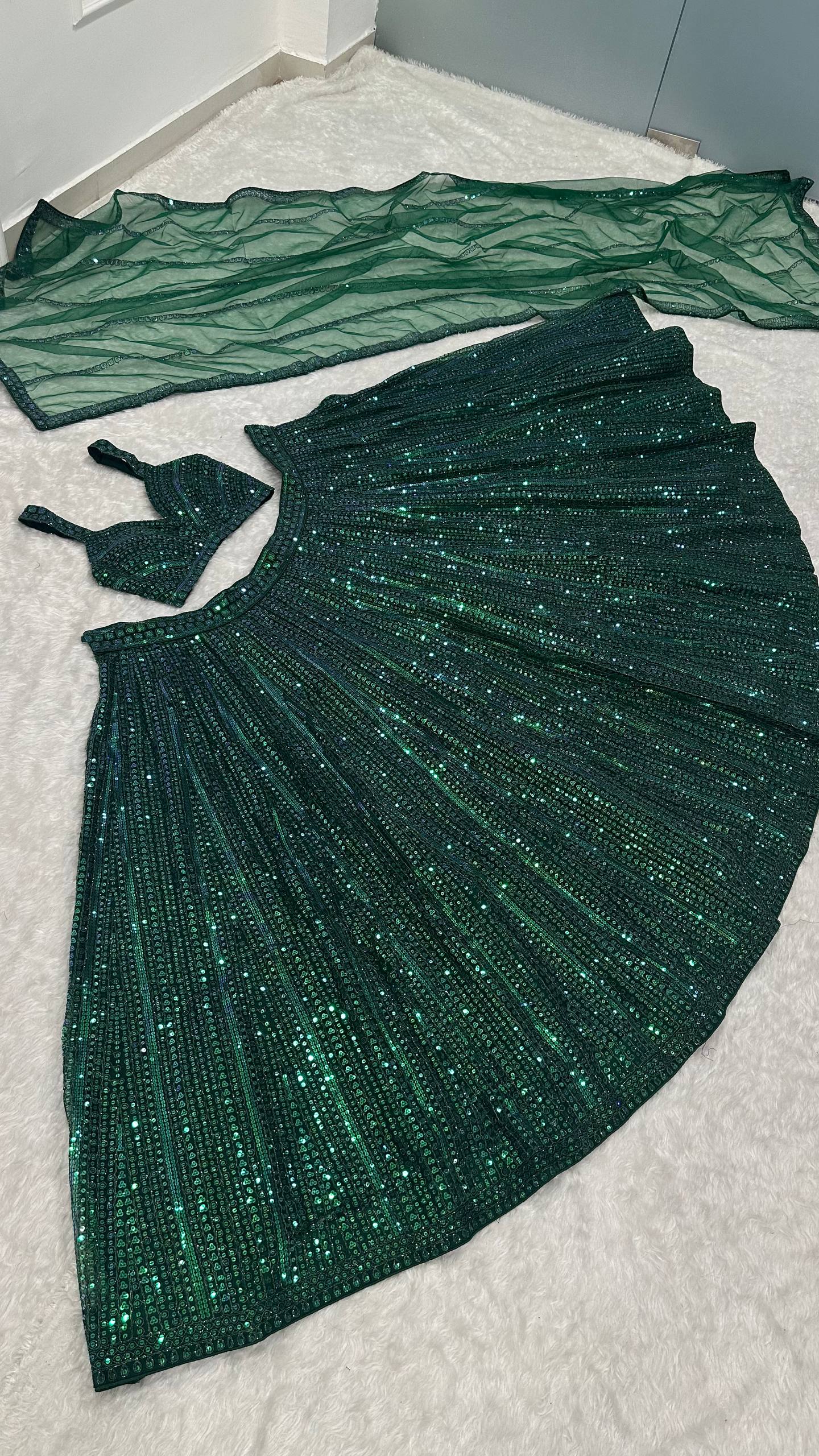 Net lehenga with rainbow sequins & dori work choli