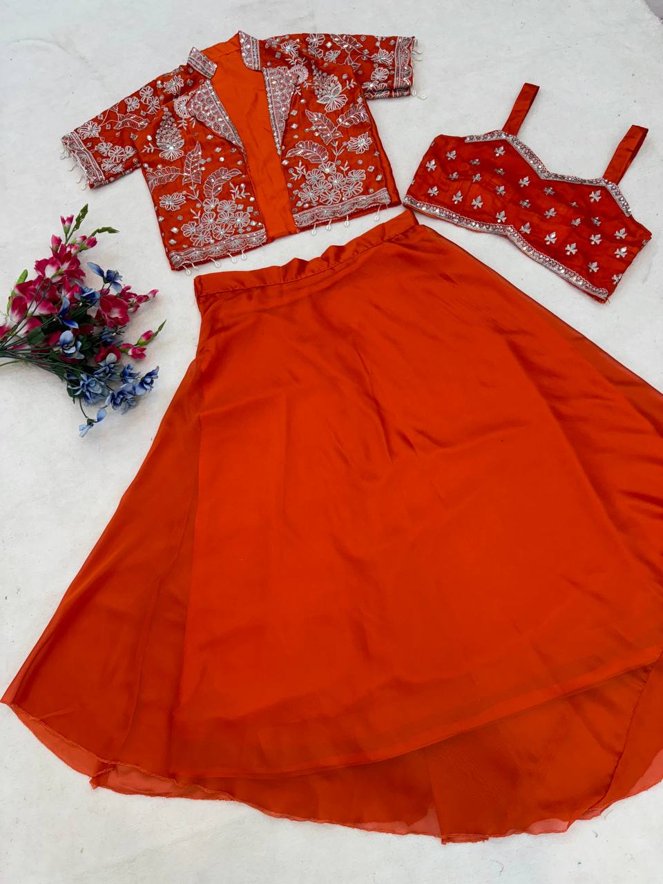 Experience effortless luxury with this premium Orange Lehenga choli