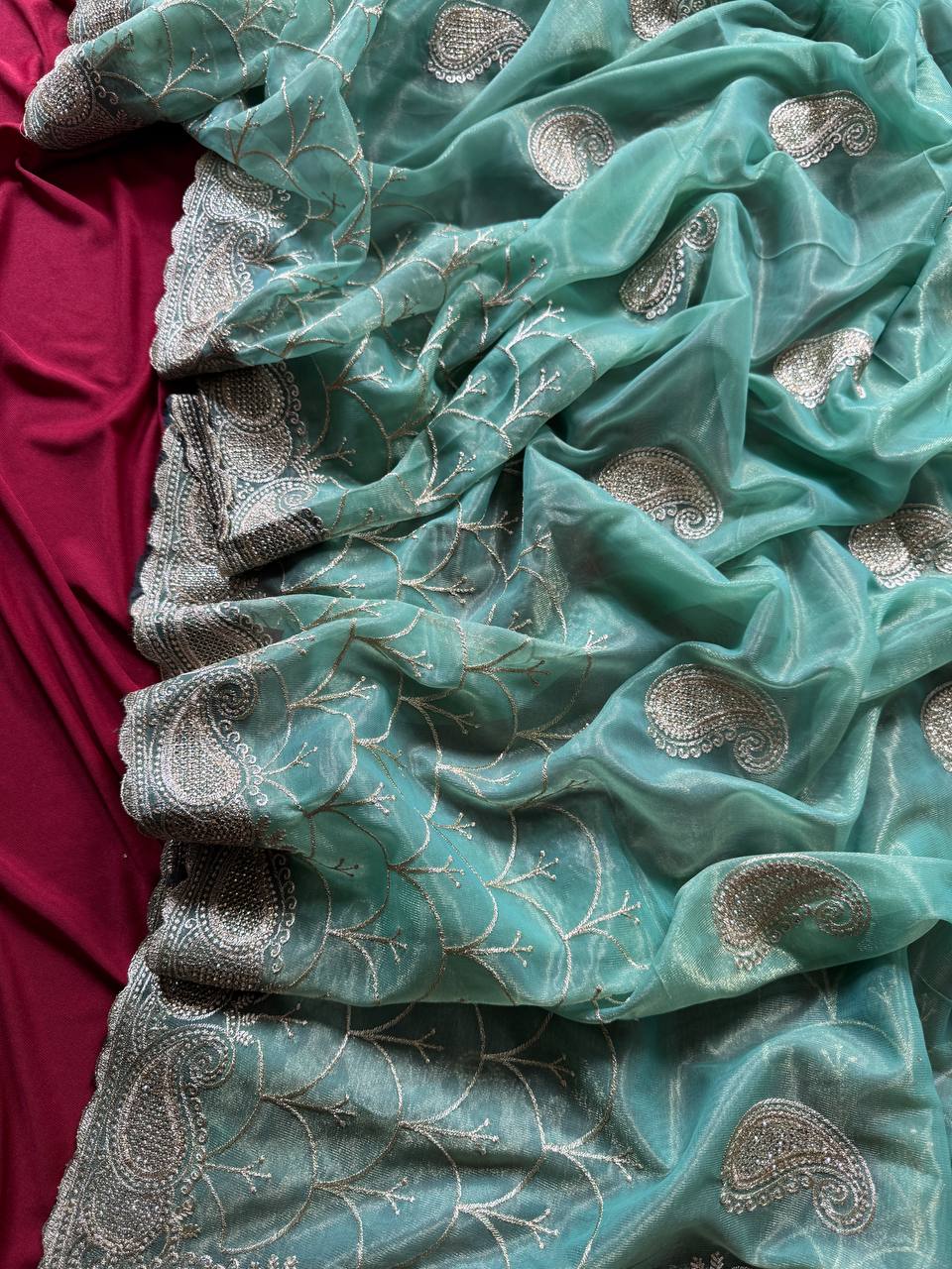 Pure zari tissue silk saree in a solid color with embroidery saree