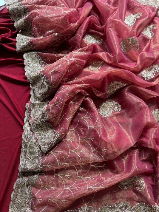 Pure zari tissue silk saree in a solid color with embroidery saree
