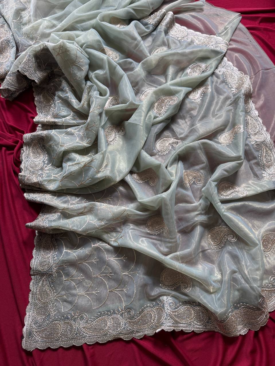 Pure zari tissue silk saree in a solid color with embroidery saree