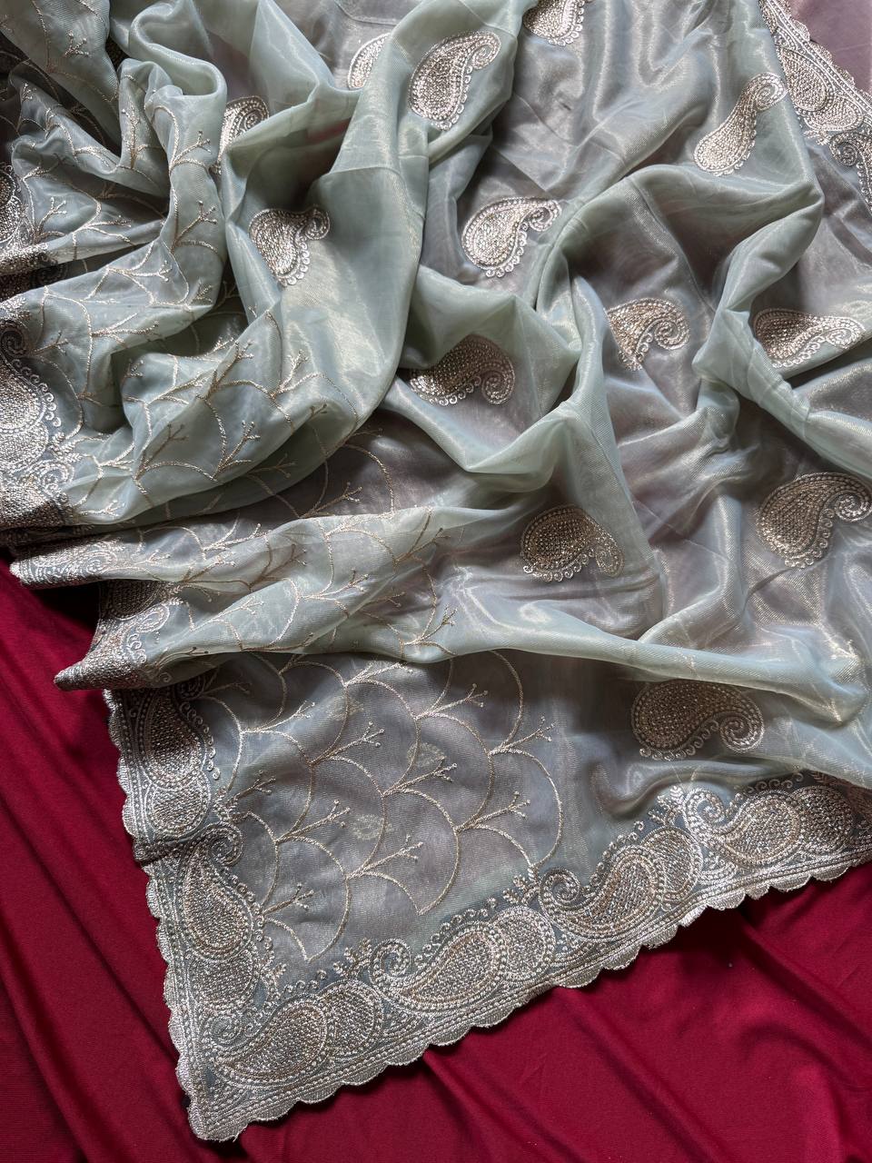 Pure zari tissue silk saree in a solid color with embroidery saree