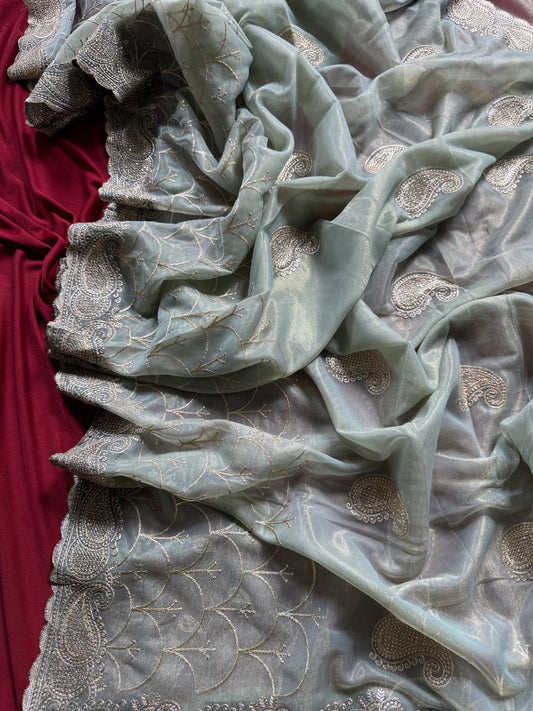Pure zari tissue silk saree in a solid color with embroidery saree