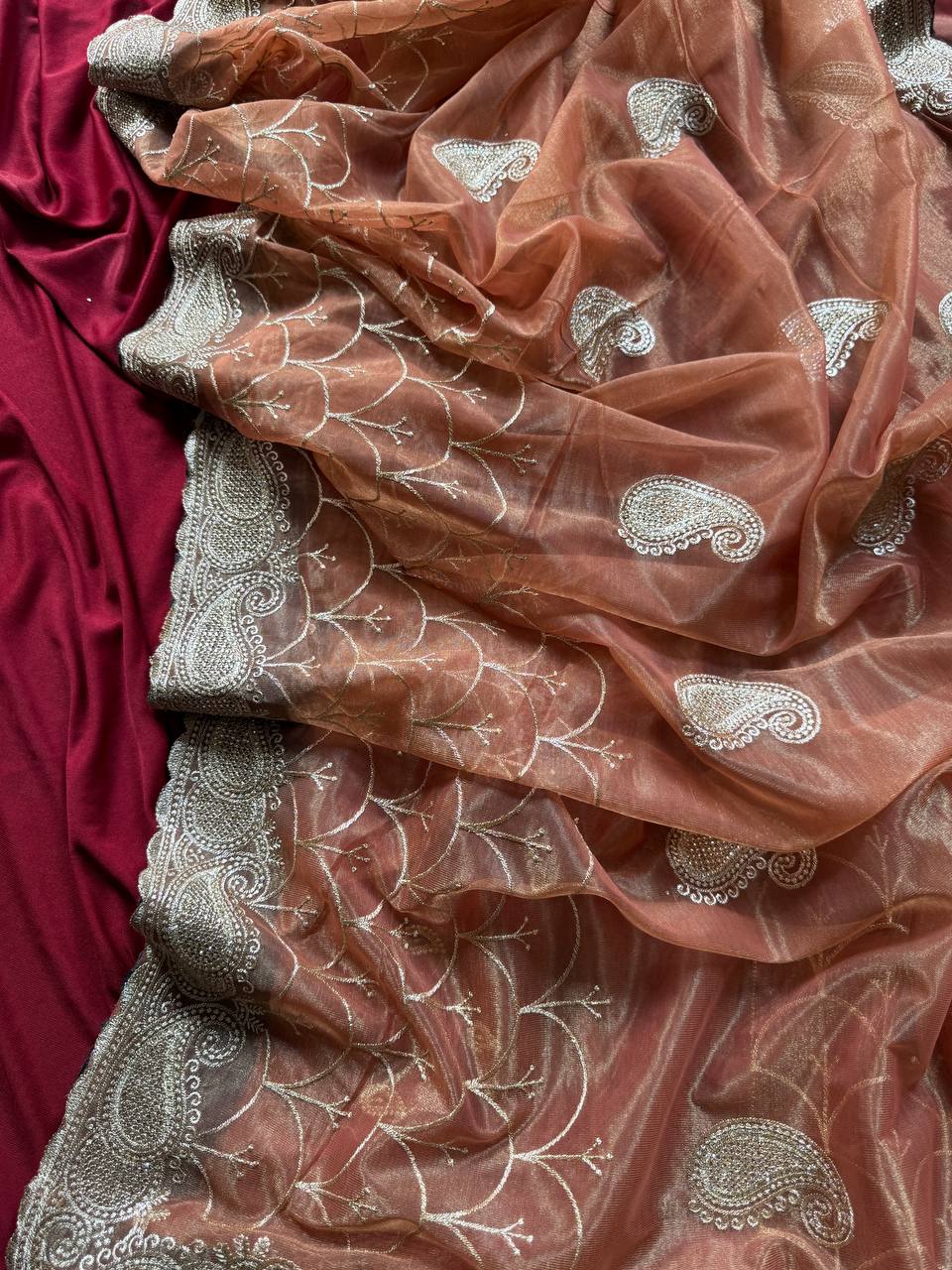 Pure zari tissue silk saree in a solid color with embroidery saree