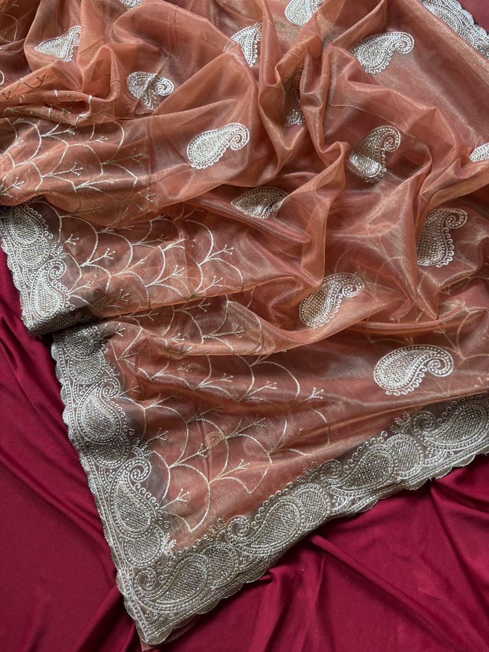 Pure zari tissue silk saree in a solid color with embroidery saree