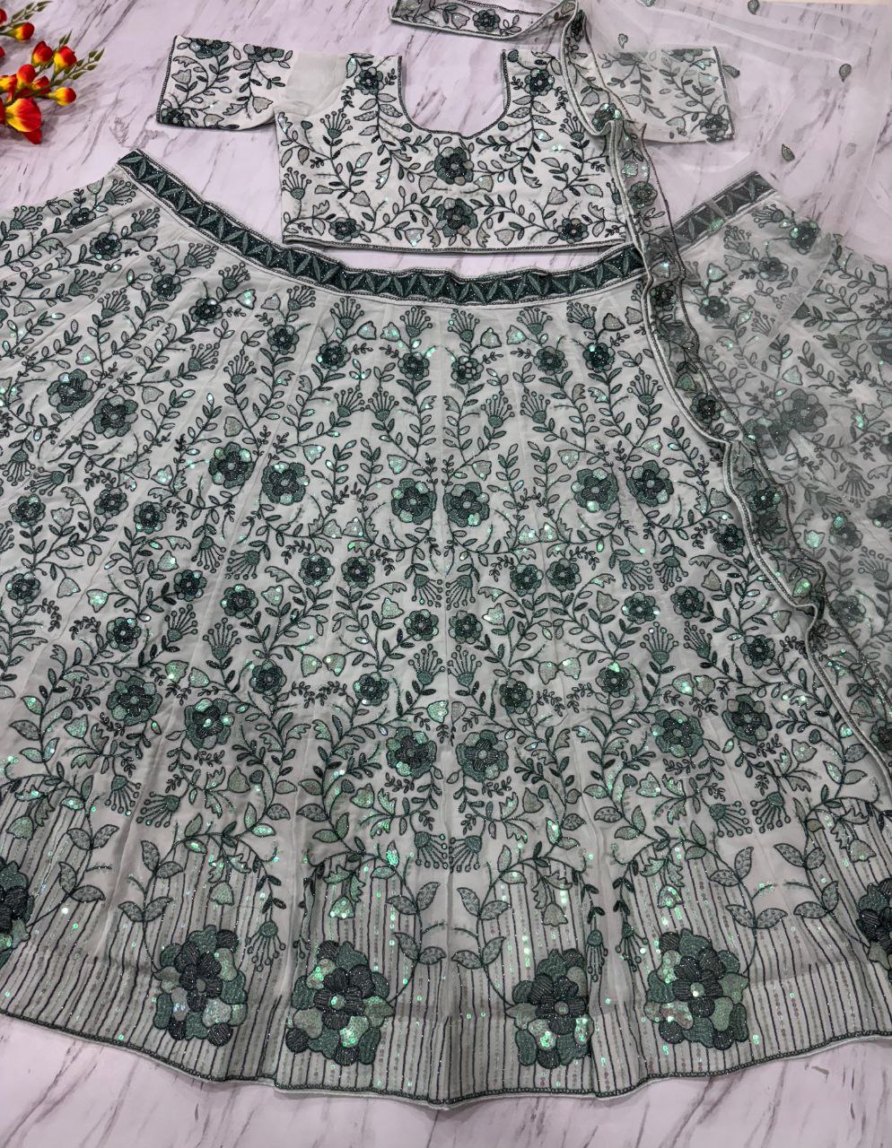 Premium Faux Georgette Embellished With Beautiful Thread Embroidery Lehenga