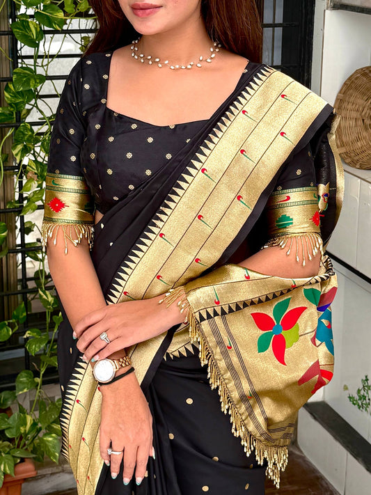 Royal blend of tradition and luxury Unveiling this black woven zari silk saree