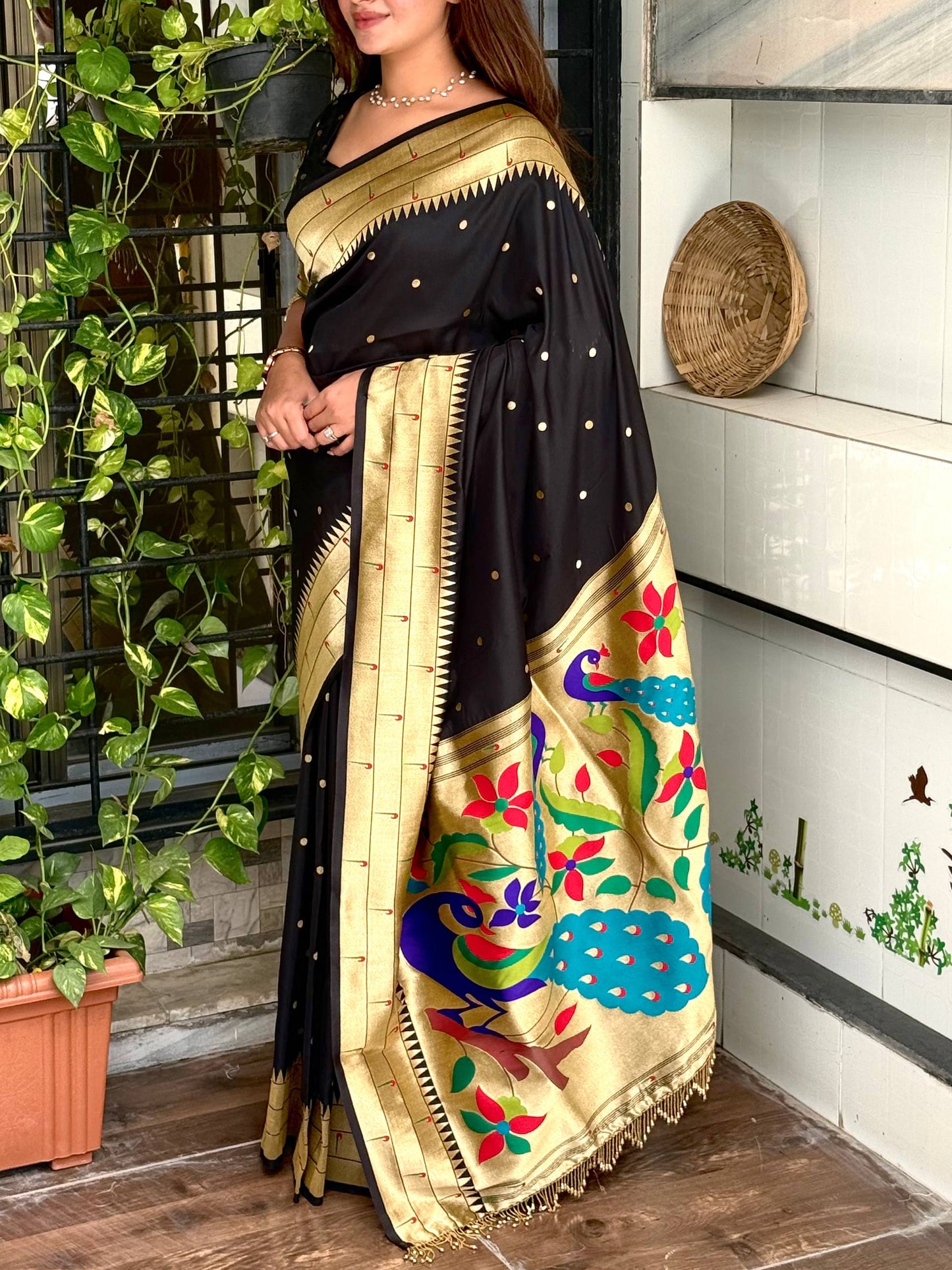 Royal blend of tradition and luxury Unveiling this black woven zari silk saree