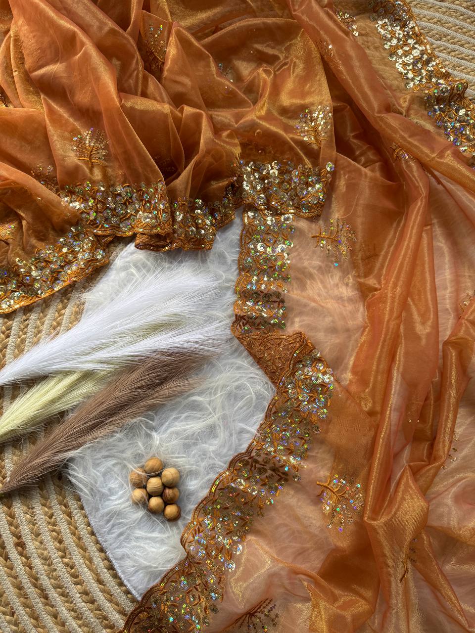 Pure Tissue silk saree in a solid color with embroidery viscos saree