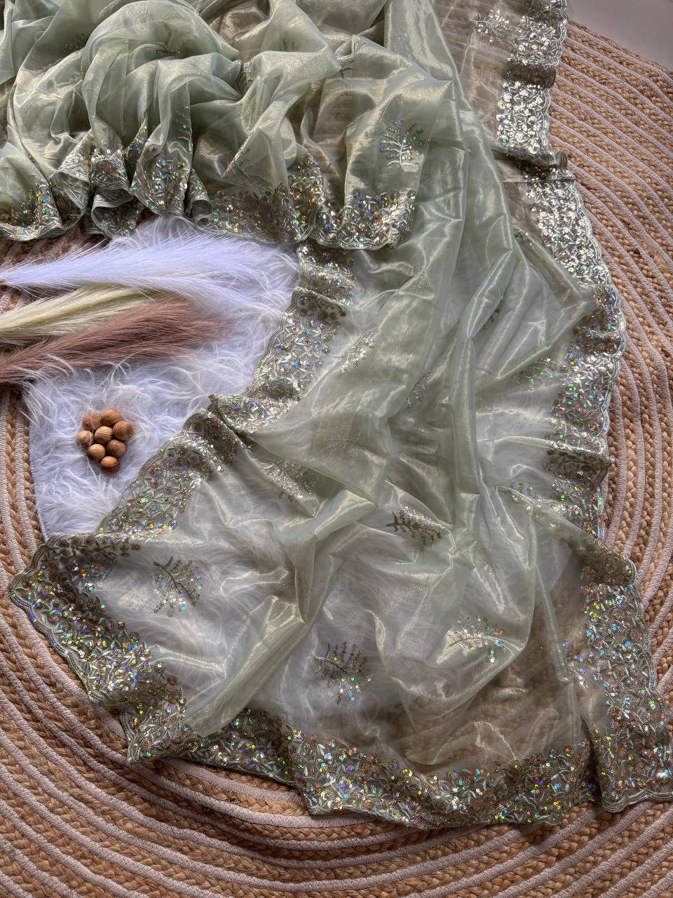 Pure Tissue silk saree in a solid color with embroidery viscos saree