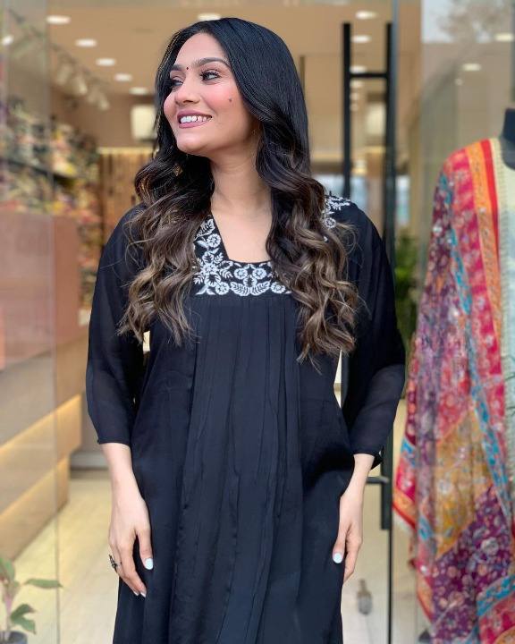 Black Color Kurti Suit Set  seems to be a party wear outfit