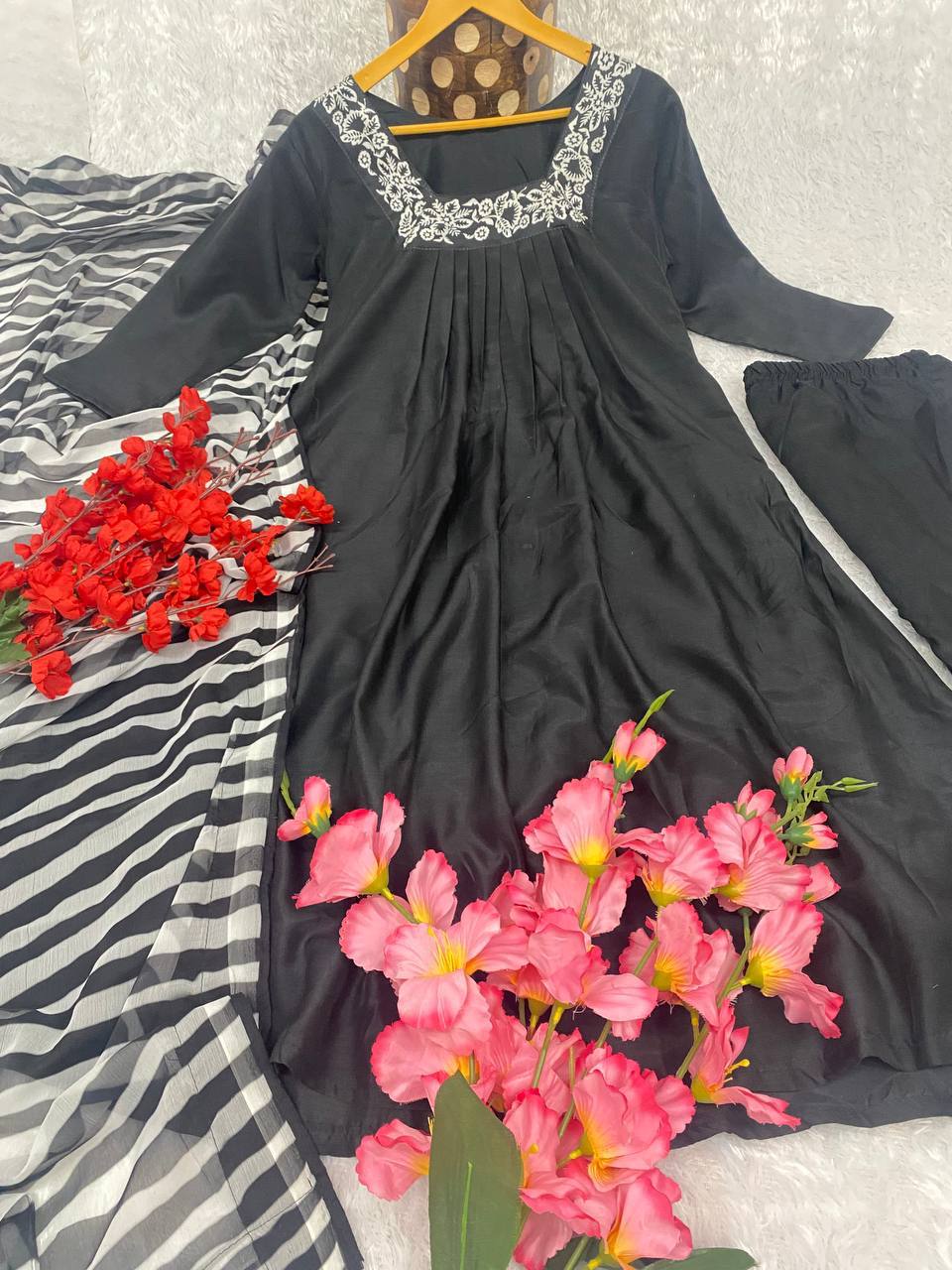 Black Color Kurti Suit Set  seems to be a party wear outfit