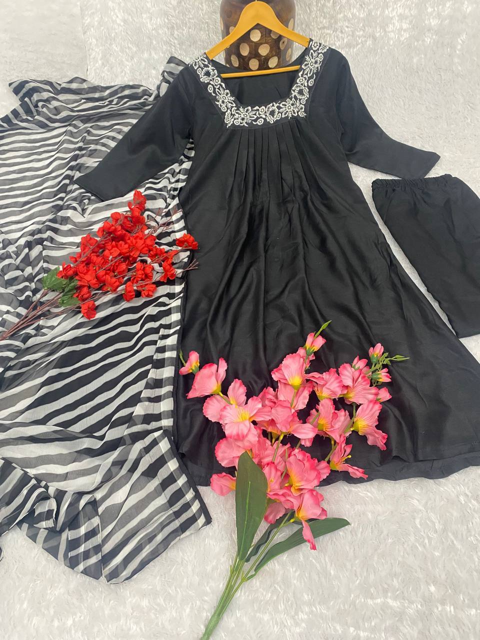 Black Color Kurti Suit Set  seems to be a party wear outfit