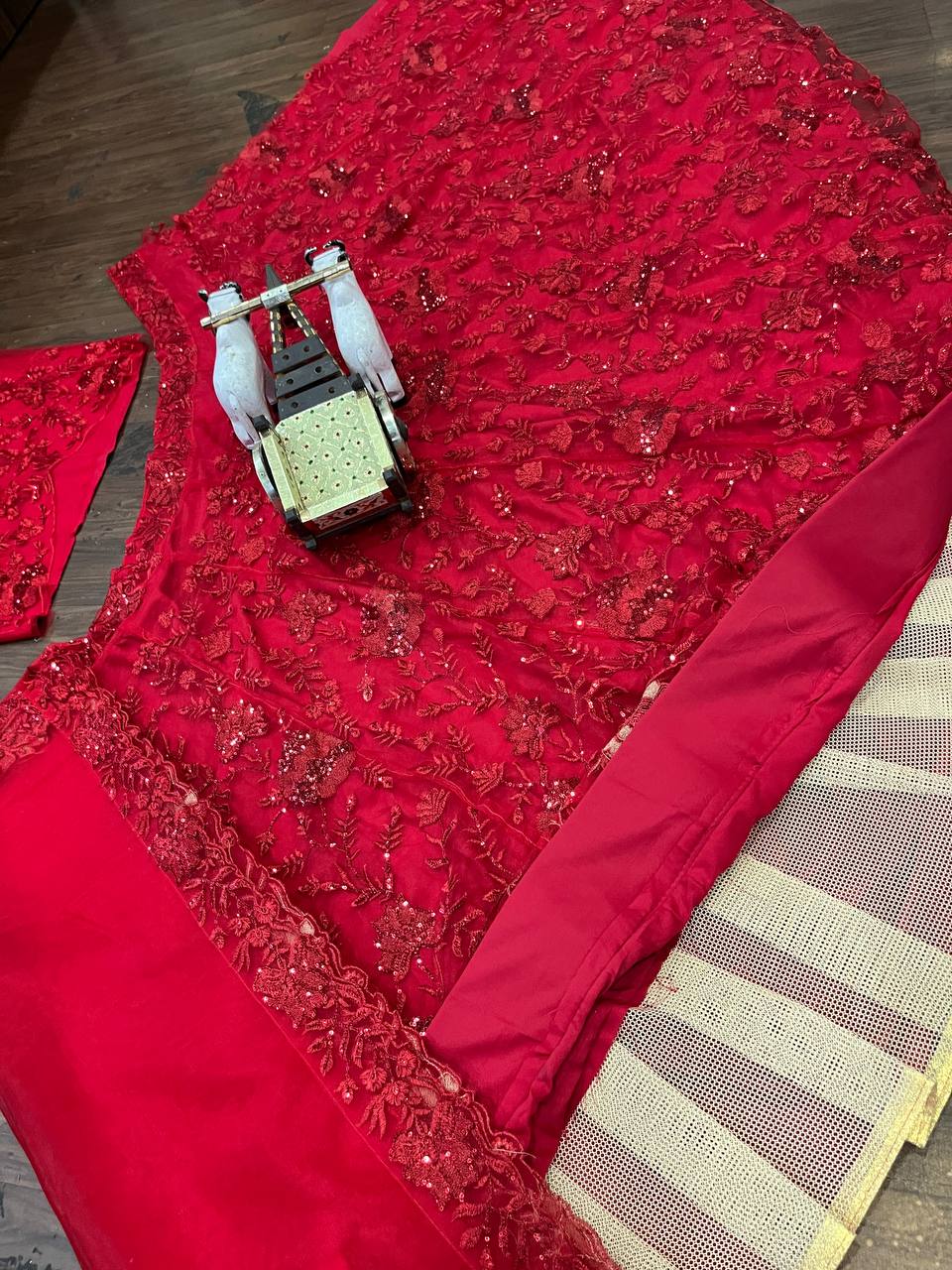 Launching Red opulent lehenga features meticulous sequin embroidery