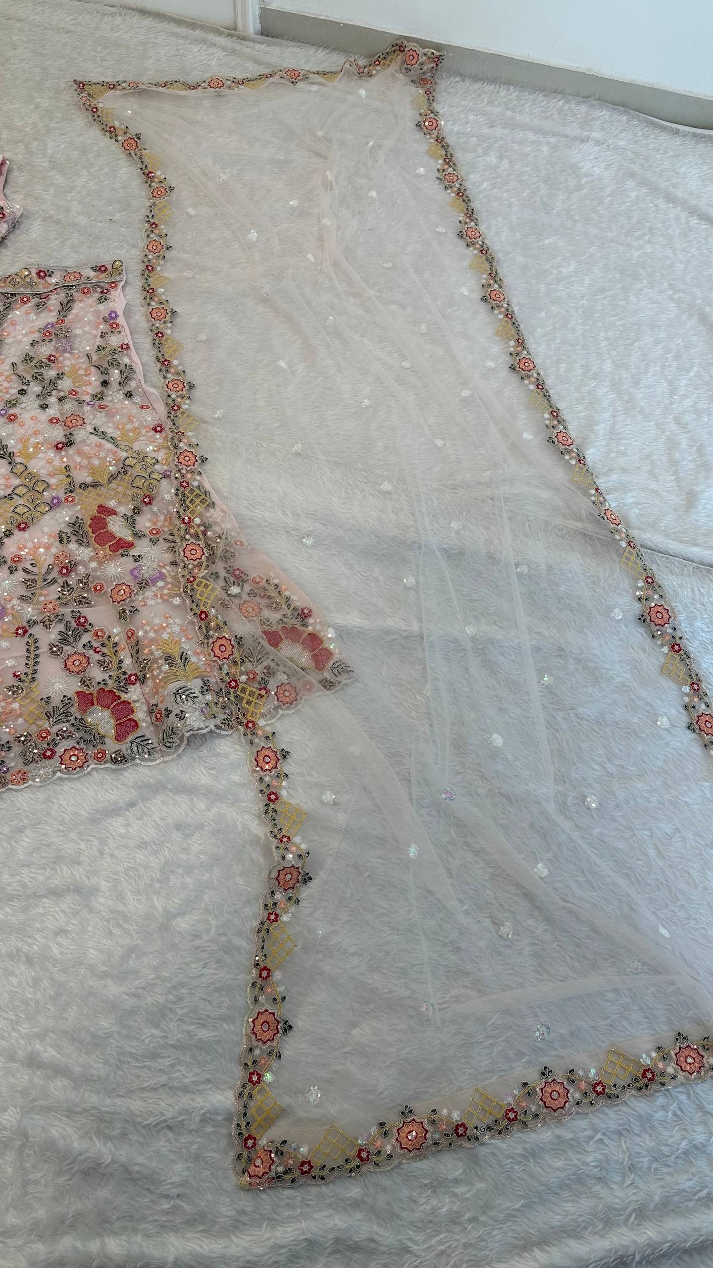 Net lehenga with rainbow sequins Dori & thread work choli