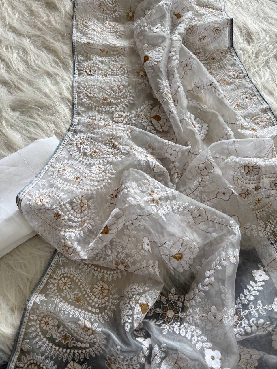 Organza Silk and the making being chikankari saree