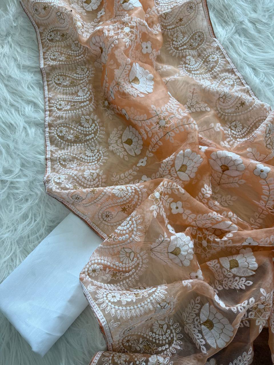 Organza Silk and the making being chikankari saree