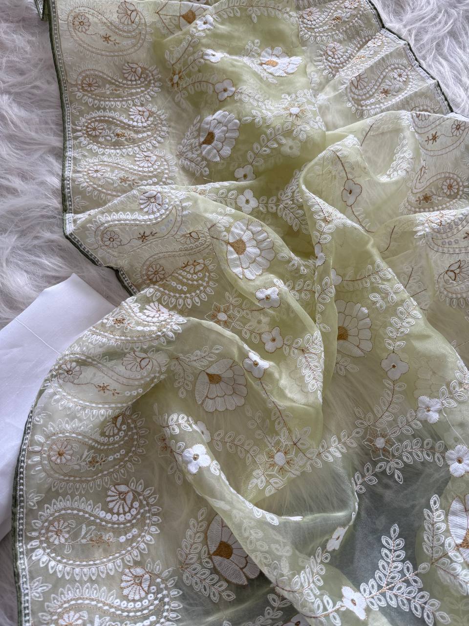Organza Silk and the making being chikankari saree